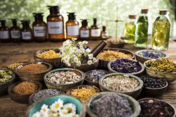 Natural remedy healing herbs background herbal medicine wooden table 165253498